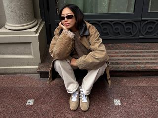 Aimee Song wearing suede sneakers