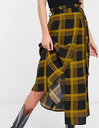 ASOS DESIGN midi skirt with belt detail in mustard check |ASOS | £32
Featuring a D-ring belt that makes it easily adjustable, this mustard check skirt also has a stylish wrap-front and high-waisted design.