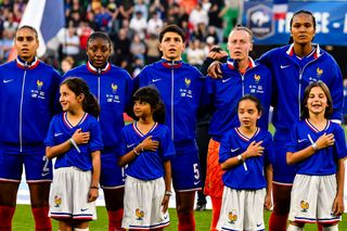 France women Olympics 2024 squad Maelle Lakrar, Kadidiatou Diani, Elisa De Almeida, goalkeeper Pauline Peyraud-Magnin and Wendie Renard of France stand on the field before the UEFA Women's EURO 2025 qualifying match between France and England at Stade Geoffroy-Guichard on June 4, 2024 in Saint-Etienne, France. (Photo by Eurasia Sport Images/Getty Images)