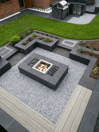 sunken garden with built-in seating and central firepit