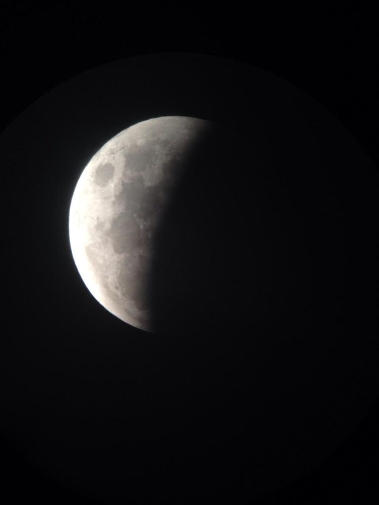 The moon is seen in mid-eclipse on Oct. 8, 2014 in this photo from the Adler Planetarium in Chicago, Illinois. 