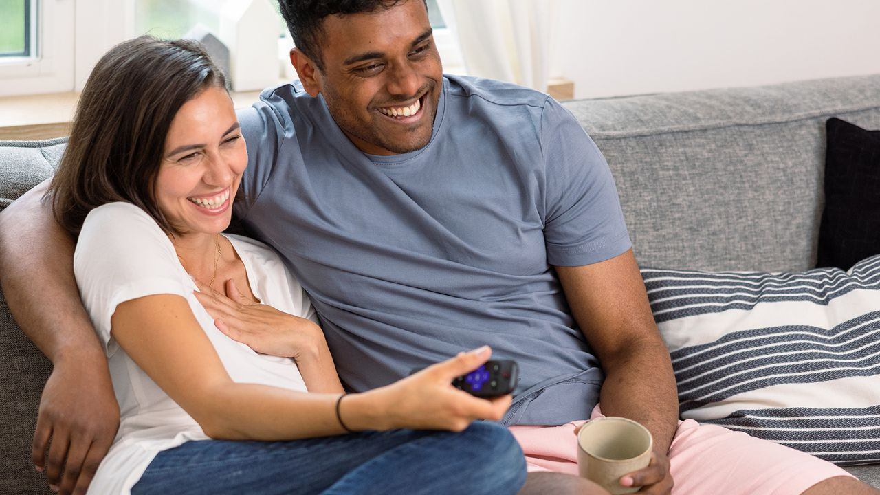 Couple watching TV on Roku