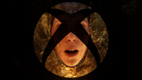 An Xbox logo, superimposed on a picture of Senua from Hellblade. 