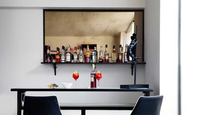 a wet bar set up on a mirror