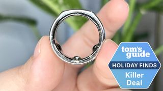 Oura Ring 3 in a user's hand next to a holiday deals badge