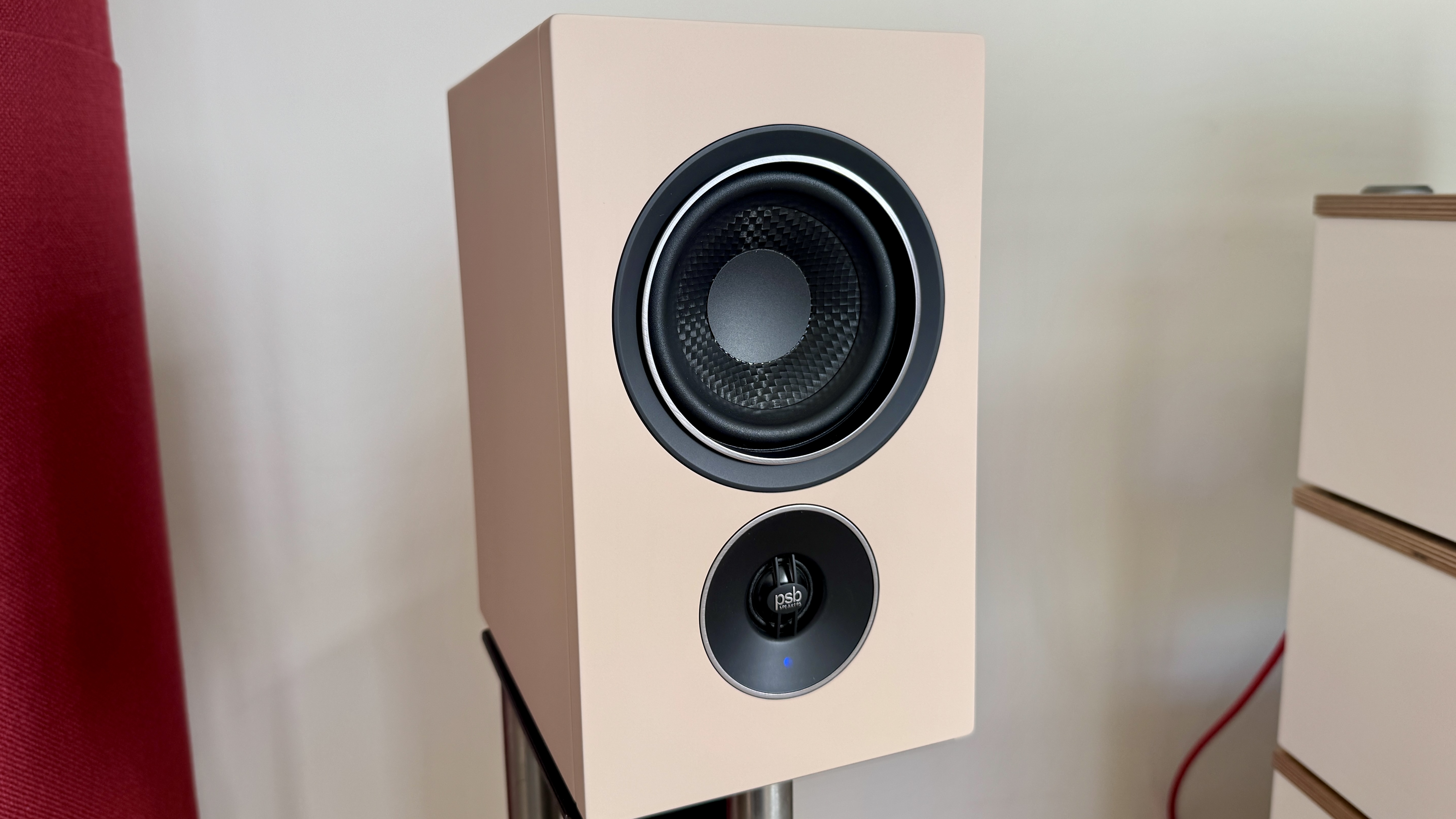 PSB iQ2 stereo speaker, on a metal stand.