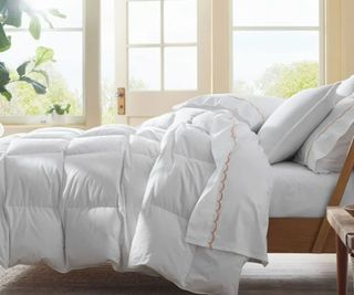LaCrosse Premium Down Light Warmth Comforter on a bed.