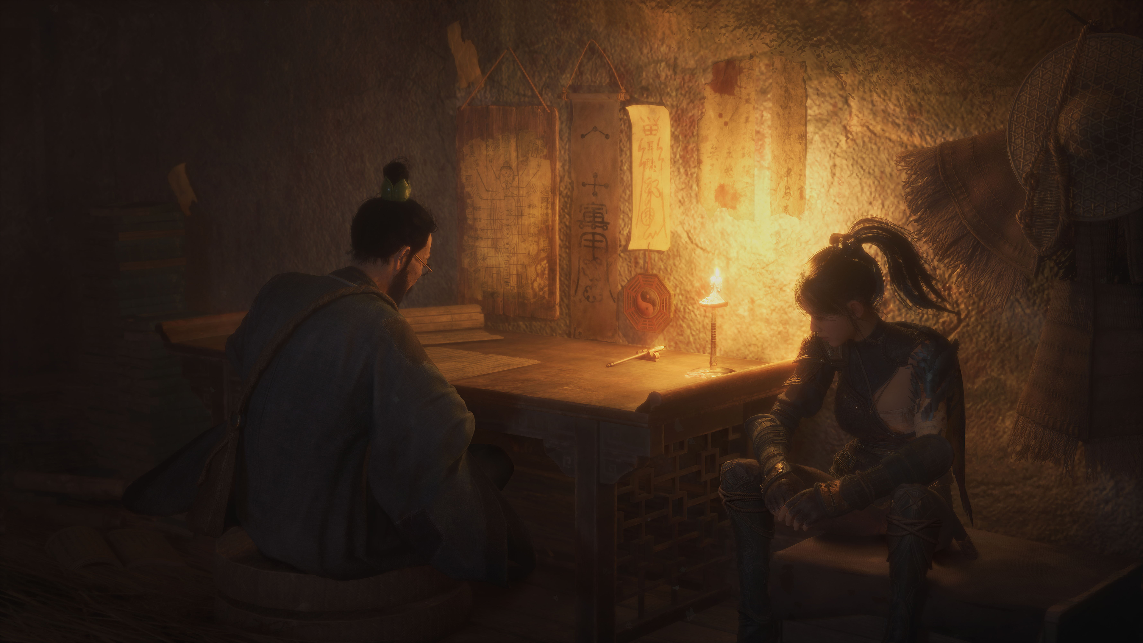 The protagonist of Wuchang Fallen Feathers sits next to a man at a candlelit desk