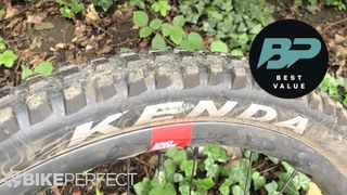 Closeup of Kenda Pinner Pro mountain bike tire with best value badge
