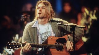 kurt cobain playing the guitar