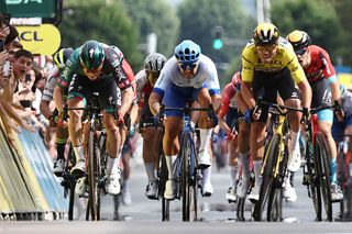 Sam Bennet (L) and Dylan Groenewegen (C) were relegated in this sprint on stage 3 of the 2023 Criterium du Dauphine