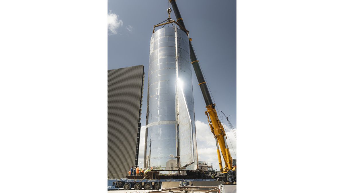 SpaceX founder and CEO Elon Musk tweeted this photo of the bottom half of the Starship Mk1 prototype being lifted above a transporter on Sept. 25, 2019.