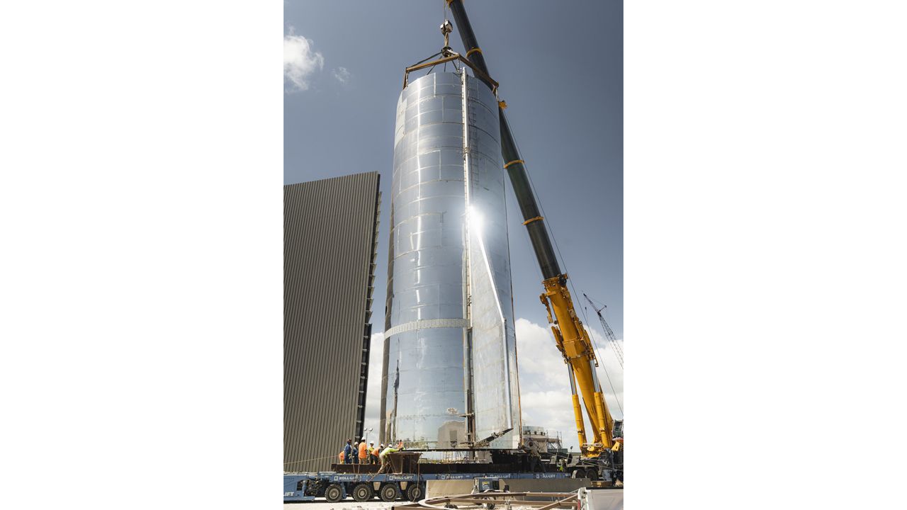 SpaceX founder and CEO Elon Musk tweeted this photo of the bottom half of the Starship Mk1 prototype being lifted above a transporter on Sept. 25, 2019.