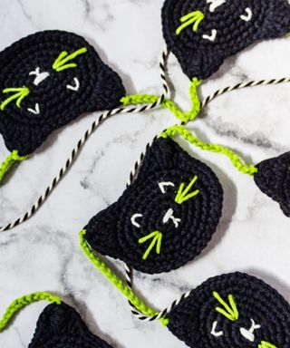 Crochet black cat garland with black and lime green wool