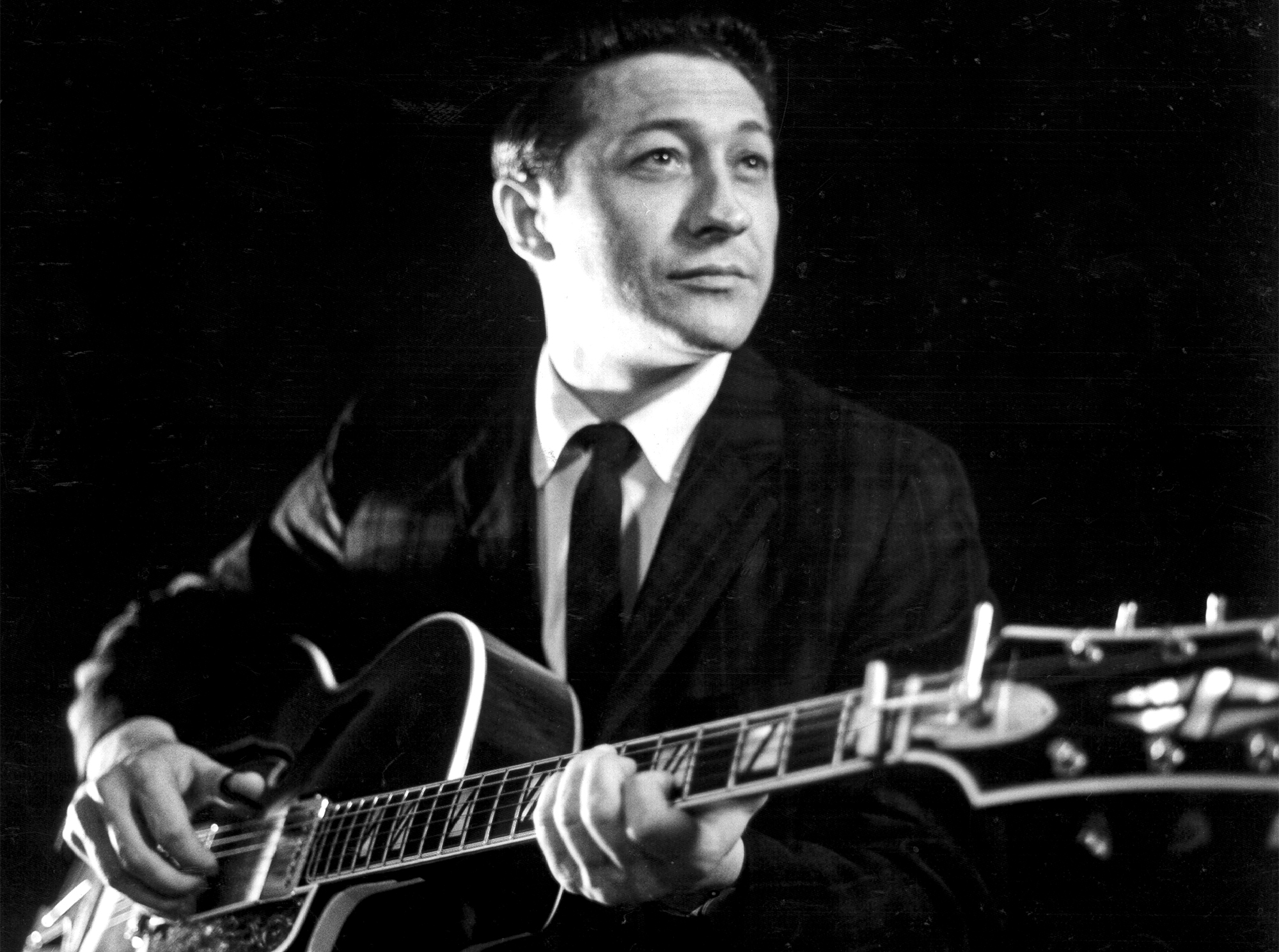Scotty Moore plays a hollow Body electric guitar in circa 1958.