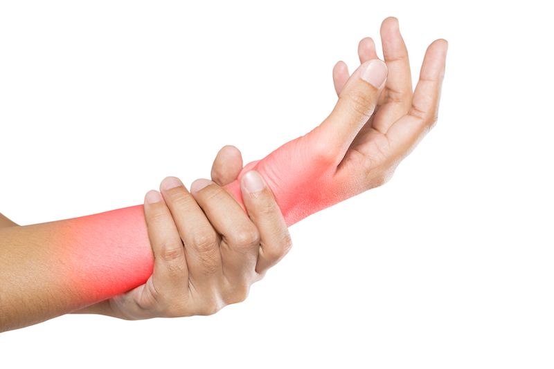 A woman suffers pain in her wrist and forearm.