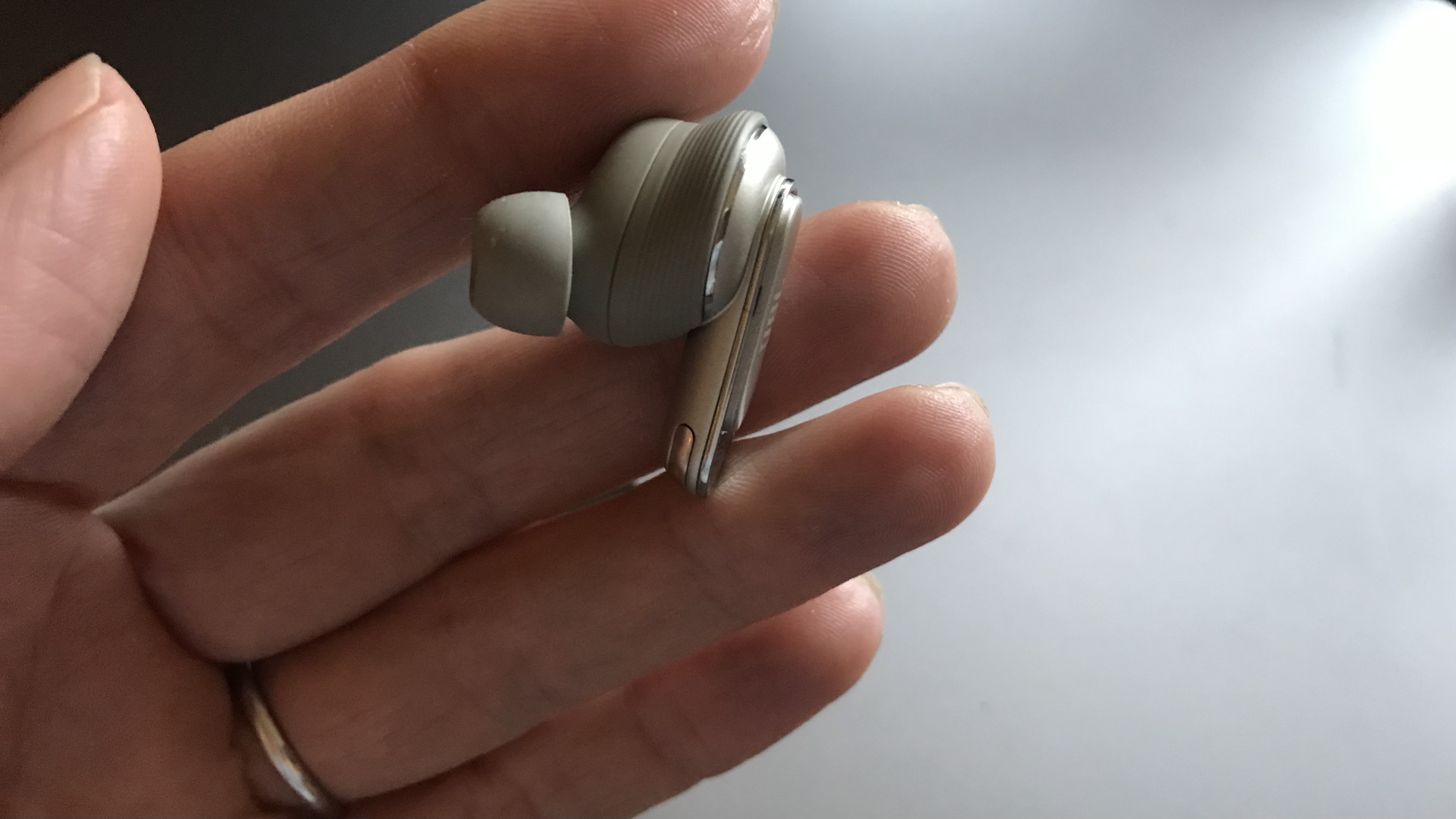 JBL Tour Pro 2 earbud held in hand