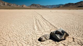 Two of Death Valley's famed "sailing stones" display distinctive trails.