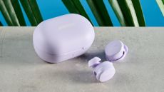 A pair of chilled lilac Bose QuietComfort Earbuds (2024)