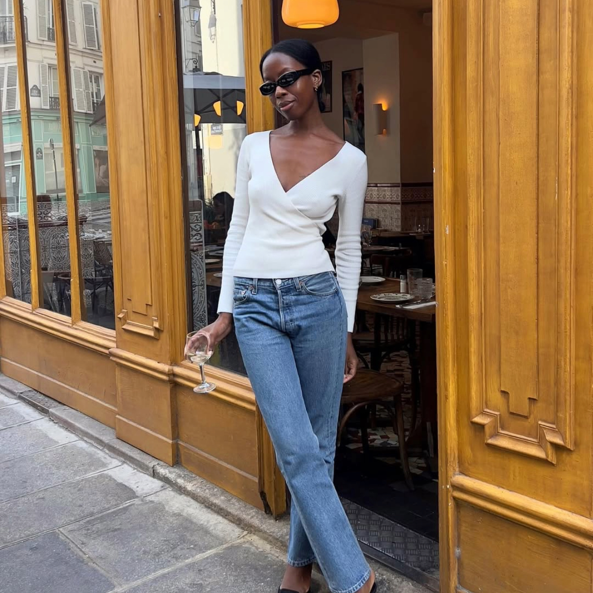 Sylvie Mus in a white top and jeans