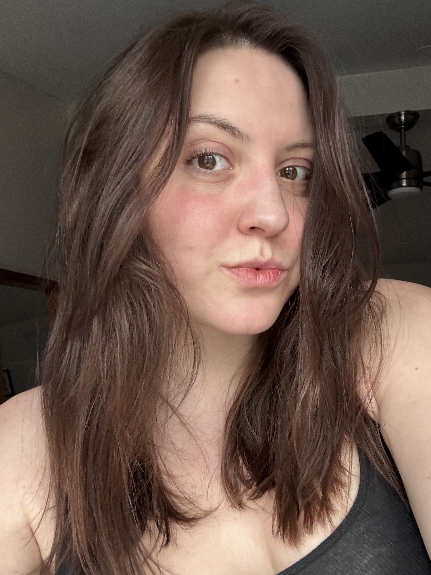 Sophia Vilensky's volumized hair immediately spritzing on R+Co Balloon spray.