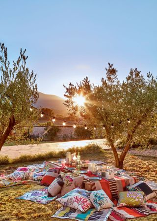 Harlequin fabrics used to created a twilight al fresco dining area