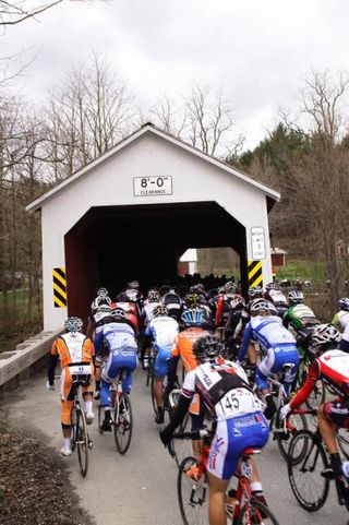 The peloton crosses the covered bridge in Eagleville early in the race.
