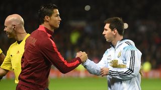 Cristiano Ronaldo and Lionel Messi shake hands before a friendly between Portugal and Argentina in 2014.