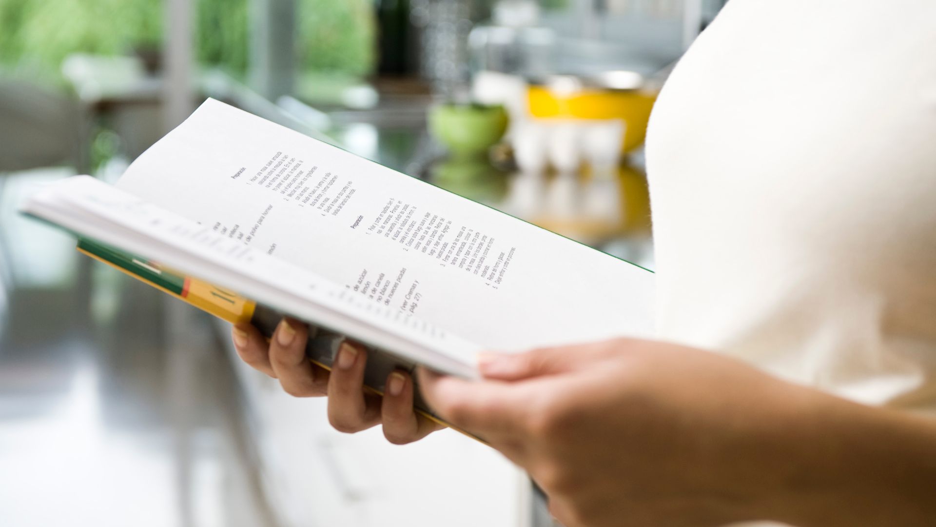 Woman reading a recipe book