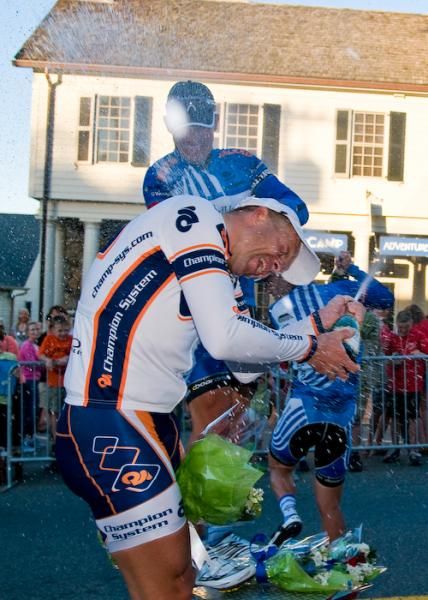 Robert Forster (UnitedHealthcare) soaks Jaan Kirsipuu (Champion System) on the podium