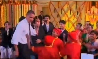 Mumbai schoolchildren encourage Obama to hit the dance floor during a Diwali celebration over the weekend.