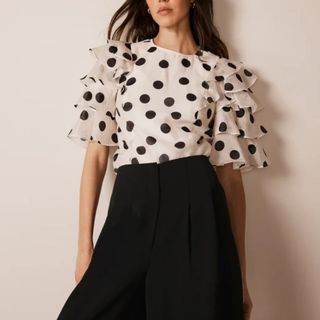 Mint Velvet White Polka Dot Ruffle Top on model 