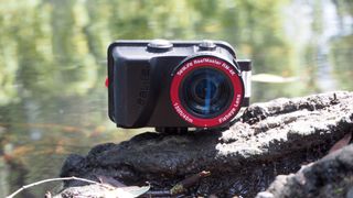 SeaLife ReefMaster RM-4K camera sitting on a log