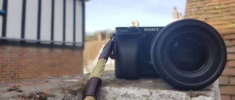 Photograph of Sony A6000 camera on stone wall: Sony A6000 review