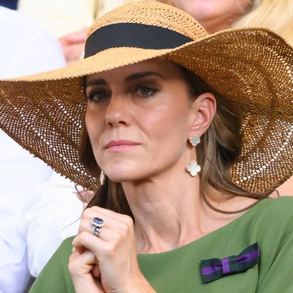 Kate Middleton wears a giant straw hat and a green dress to attend Wimbledon in July 2026
