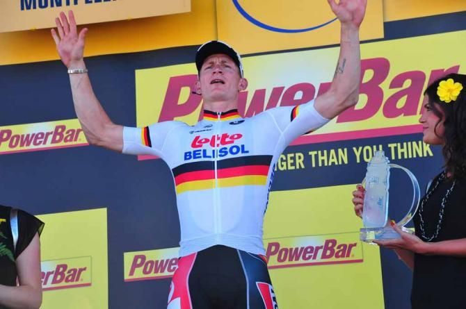 Andre Greipel (Lotto Belisol) celebrates on the podium.