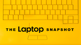 A yellow laptop keyboard with "The Laptop Snapshot" overlayed on it in black.