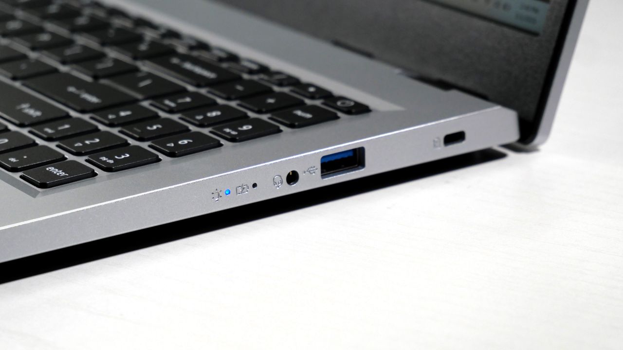 Acer Aspire 3 15 open on a white desk, highlighting the ports on the right.