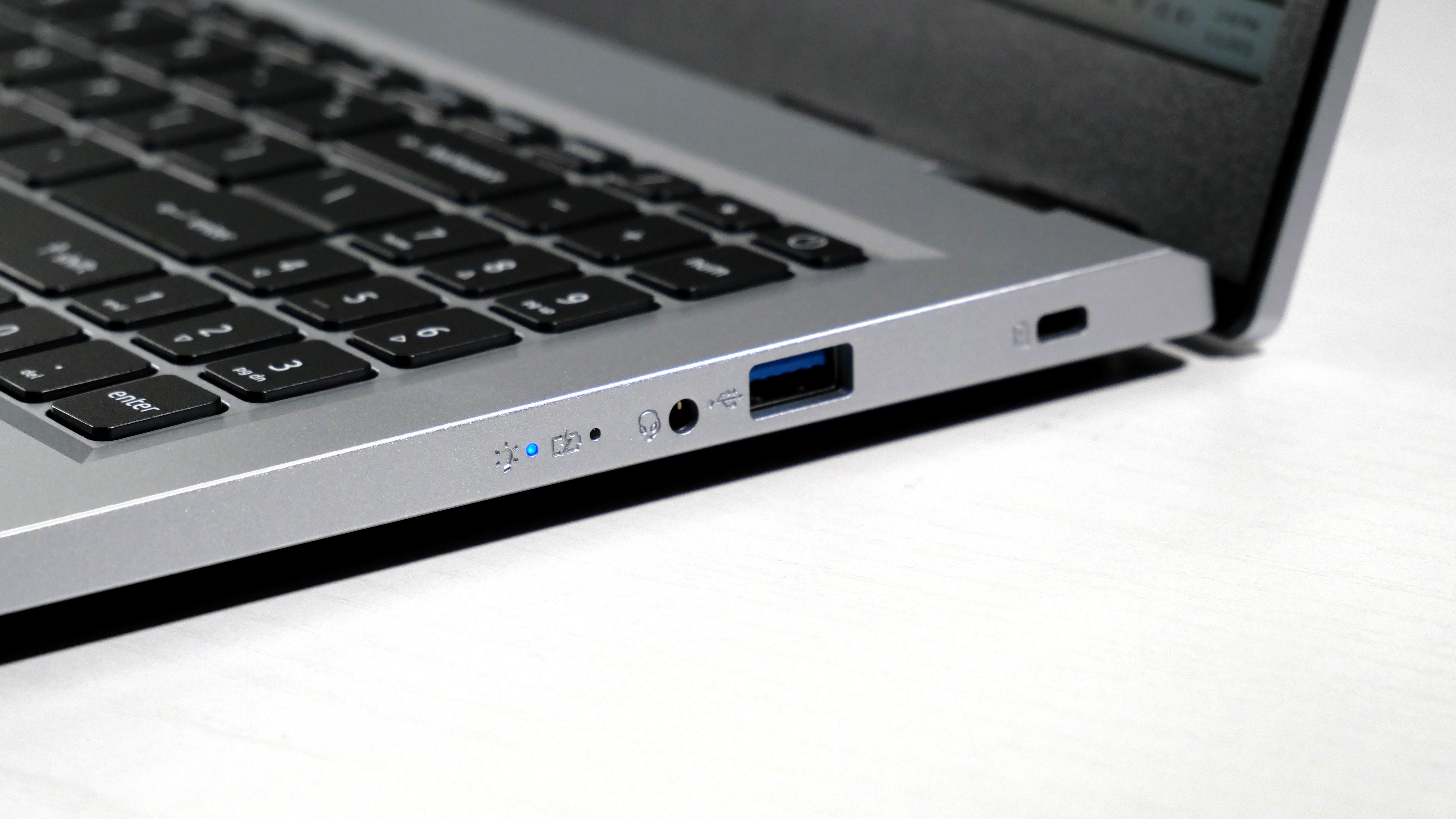Acer Aspire 3 15 open on a white desk, highlighting the ports on the right.