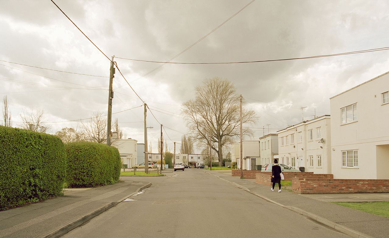 Suburban street with white houses