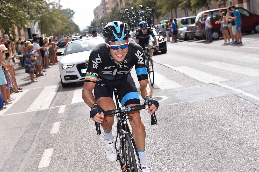 Nicholas Roche makes his way back to the peloton after crashing.