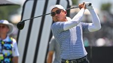 Chieh-po Lee holds his finish on a drive during a LIV Golf event