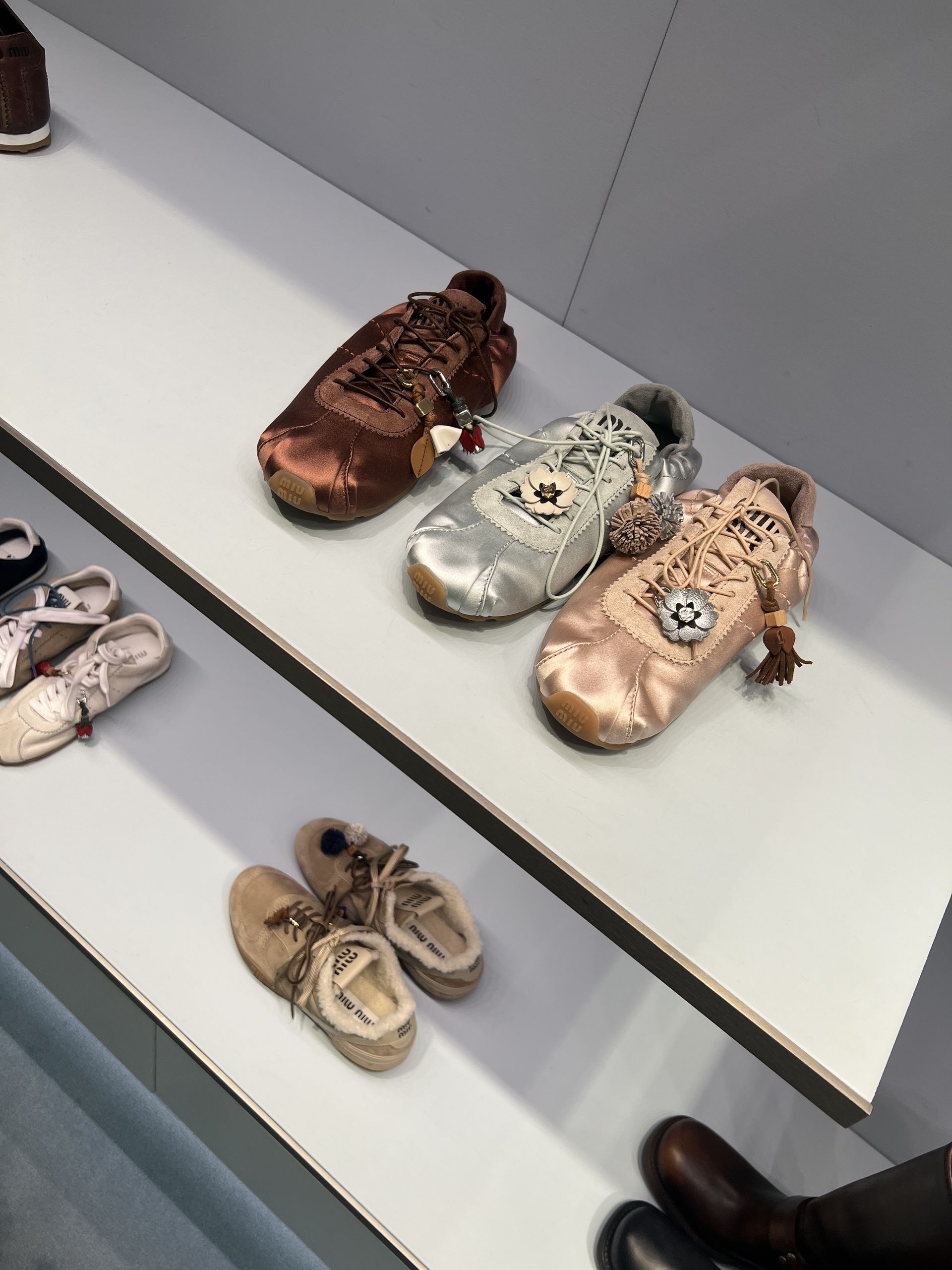 An image of satin trainers at Miu Miu.