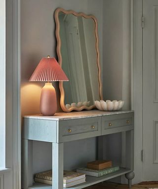 Anthropologie blue console table in entryway