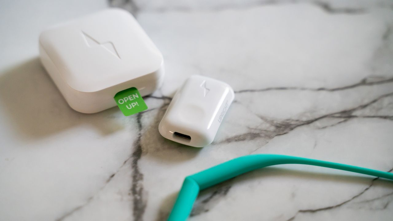 Upright Go 2 posture corrector on a marble table