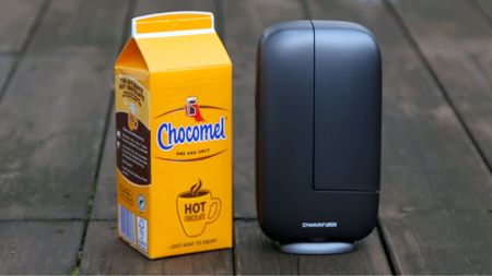 A DwarfLab Dwarf Mini, next to a Chocomel carton for size. They are both the same size. 