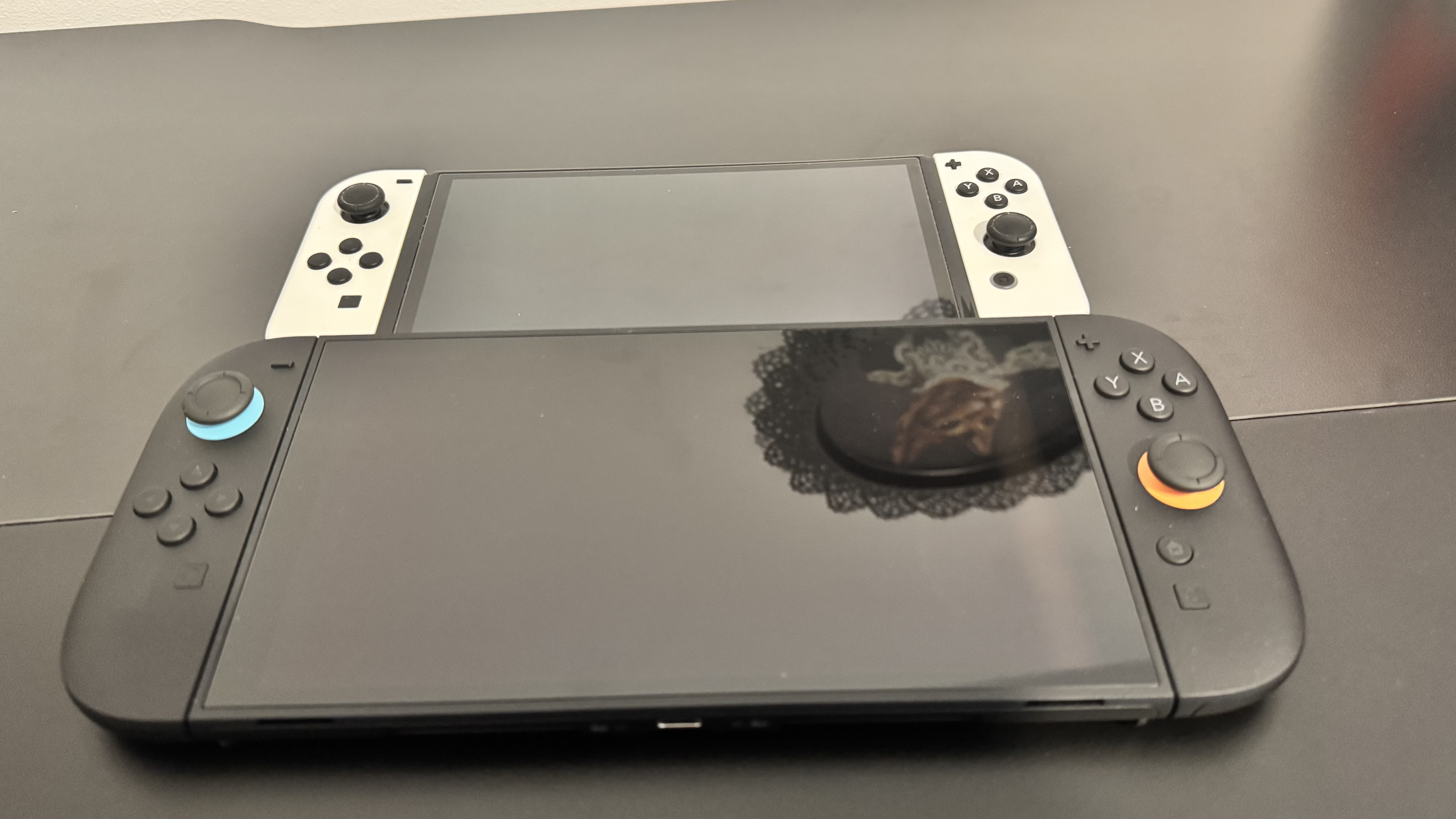 The Nintendo Switch next to the Nintendo Switch 2
