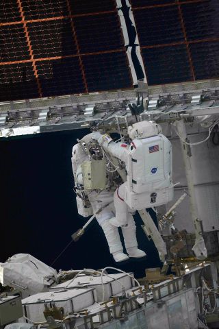 Astronauts Thomas Pesquet of ESA (right) and Shane Kimbrough of NASA deploy the first ISS Roll-Out Solar Array (iROSA) during a Sunday, June 20, 2021 spacewalk.