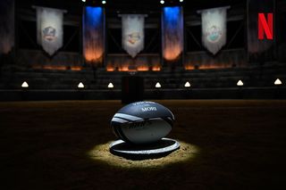 A rugby ball sits in an arena, in a promo image for 'Rugged Rugby: Conquer or Die'