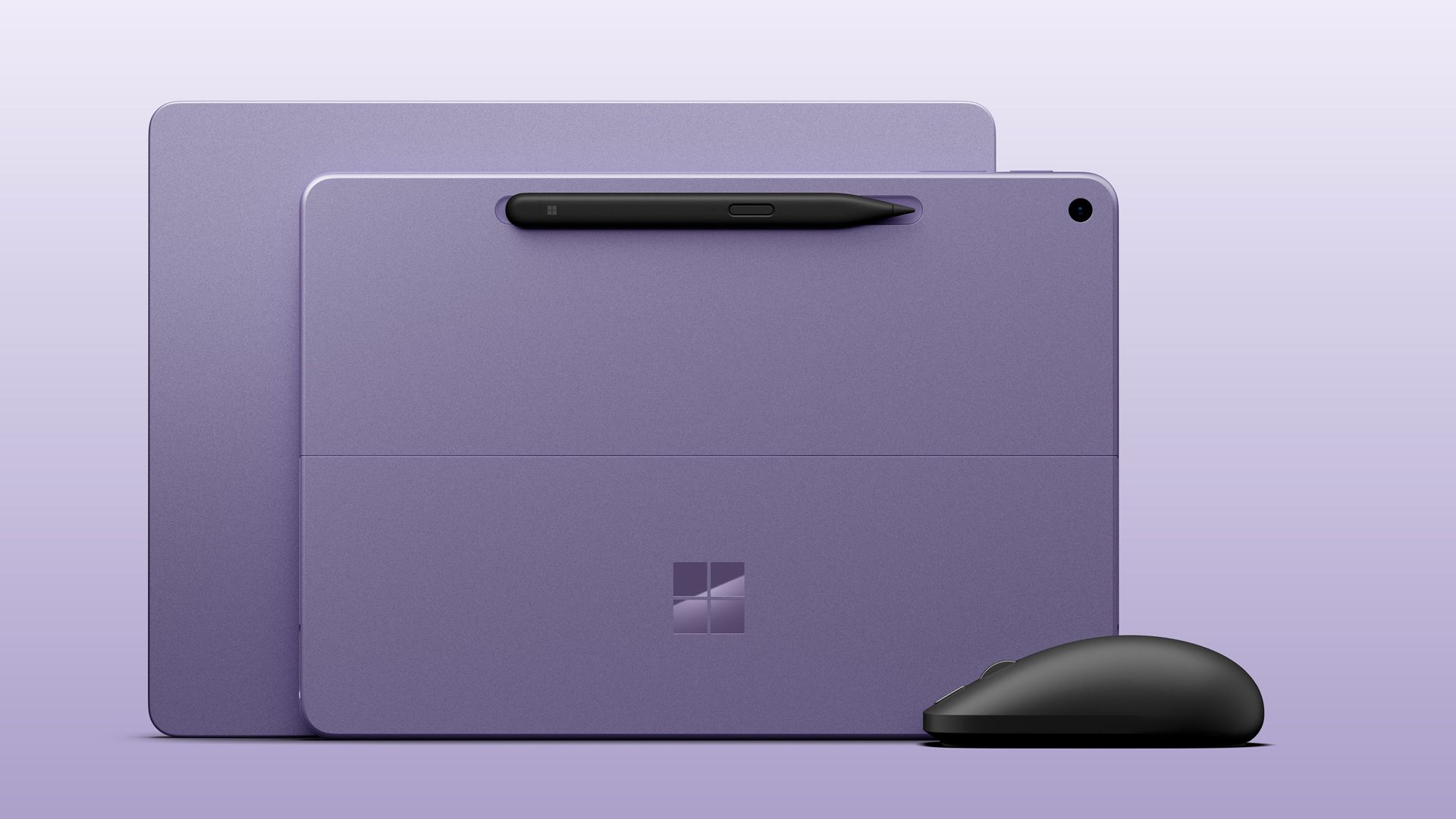 Microsoft Surface Laptop 13-inch next to Surface Laptop 12-inch, both in violet colorway next to the new black Surface Mouse.